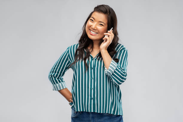istock happy asian young woman calling on smartphone 1402130540