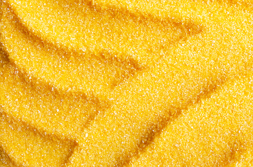 Abstract background of uncooked cornmeal
