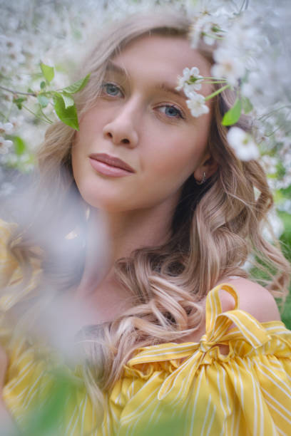 istock woman in flowers 1402130766