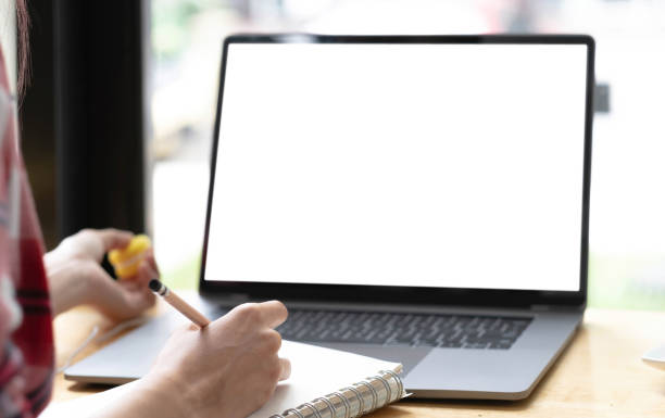 istock Young man working on his laptop with blank copy space screen for your advertising text message in office, Back view of business man hands busy using laptop at office desk 1402138300
