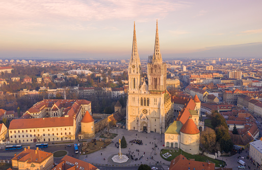 Zagreb Old Town And Cathedral in Background. Sightseeing Place in Croatia. Beautiful Sunset Light. Tourist Visiting Famous Place