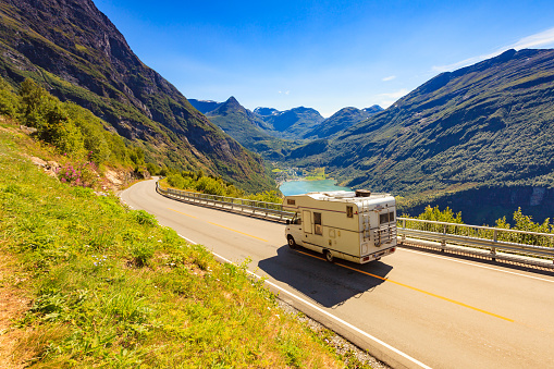 Geiranger fjord and camper car drive eagle road, Norway. Travel in motor home.