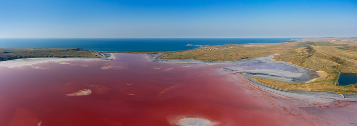 Aerial panorama view of pink lake near Black Sea - Chokrak lake in Karalarsky park, Crimea\