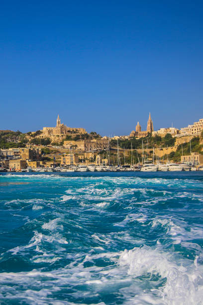 Mgarr Mgarr harbour on Gozo island on Malta. mgarr malta island gozo cityscape with harbor stock pictures, royalty-free photos & images