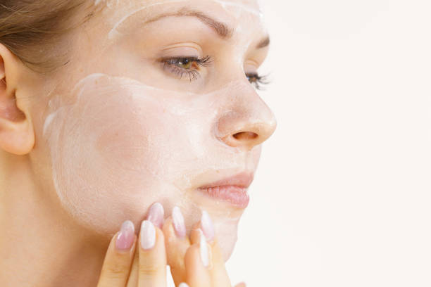 istock Girl apply cream cosmetic 1402148291