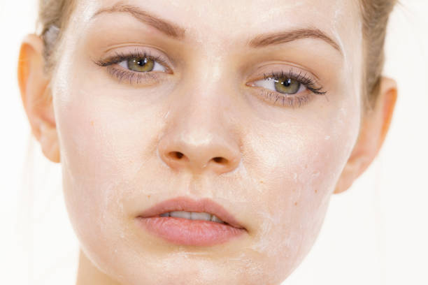 istock Girl with cream moisture cosmetic on face 1402149406