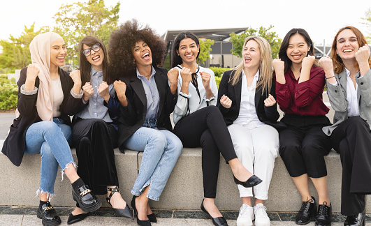 portrait multiracial business women happy, winning, celebration gesture, outdoors