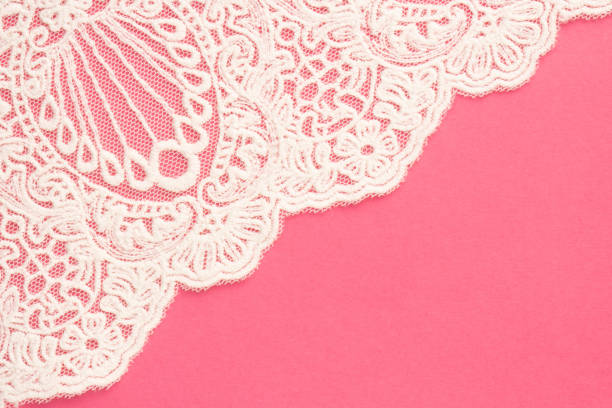 istock White lace with pattern on pink diagonally 1402154523