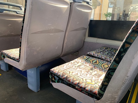 Generic colourful bus seats on an empty bus