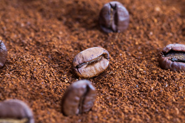 istock roasted coffee beans on the table , close up 1402156183