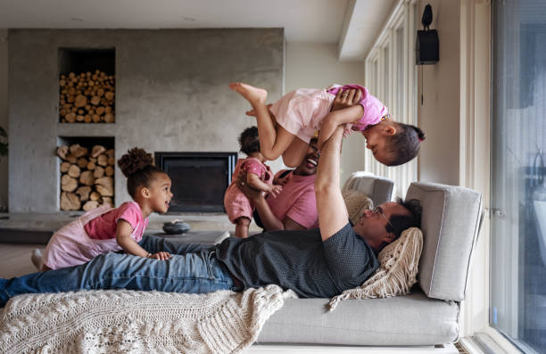 istock Multi races family in home 1402158468