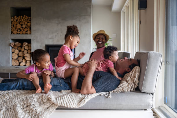 istock Multi races family in home 1402158471