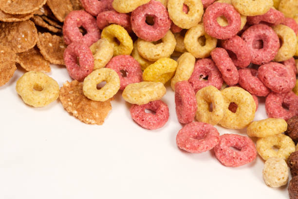 istock Cereals from corn in the form of multi-colored rings on a white background. 1402164051