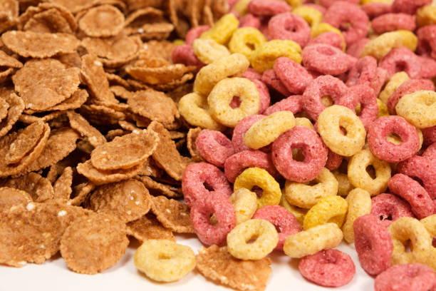 istock Close-up of wheat flakes and corn rings, top view. 1402164064