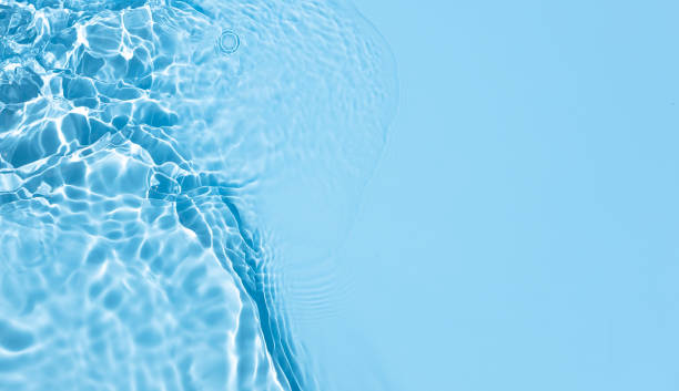 Blue Abstract background texture with water ripples and waves stock photo