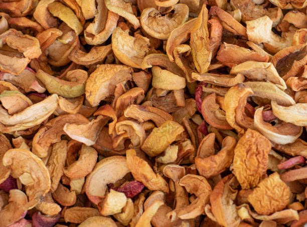 background of dried apples for compote, top view - dried apple imagens e fotografias de stock