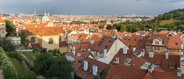 Panoramic view of Prague skyline, Czech Republic. Red roofs of old town with dark sky before storm