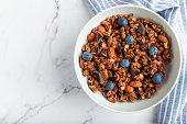 Chocolate granola, muesli with almonds, hazelnuts and blueberries