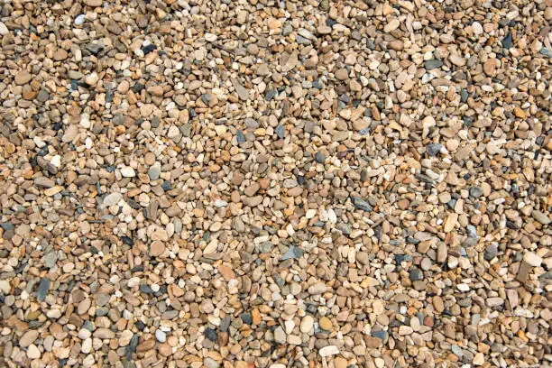 Honey brown color pebble gravel for decorate garden texture background