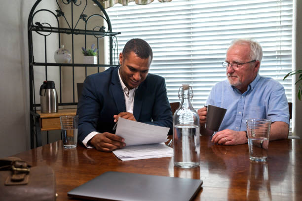 istock Mature Client Meeting With His Advisor, Discussing Options He Has For His Financial Future 1402171745