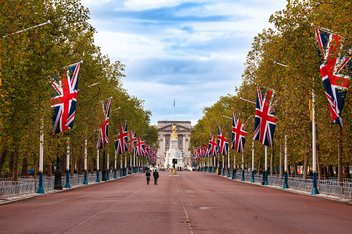 London, UK - October 28, 2012: A view along the Mall, the landmark ceremonial approach road to Buckingham Palace decorated with Union Jack flags
