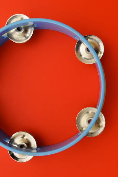 istock Tambourine isolated on red background 1402172276