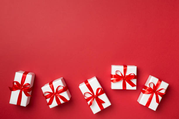 istock Top view of gift boxes on color background 1402173547