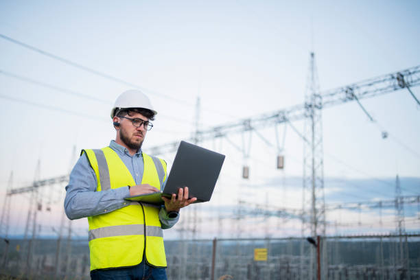 istock Engineer working on power plant with laptop. 1402174493