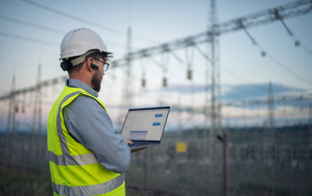 istock Successful engineer working on power plant with laptop. 1402174510