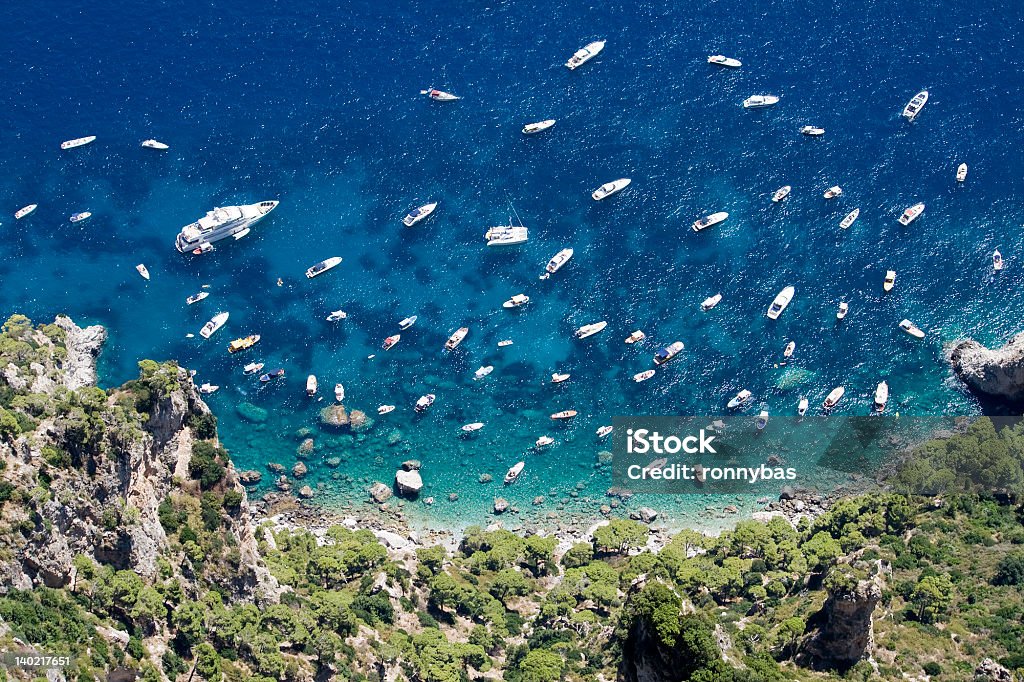 Yachts and boats in the beautiful sea of Capri Yachts and boats in the beautiful blue sea of Capri Beach Stock Photo