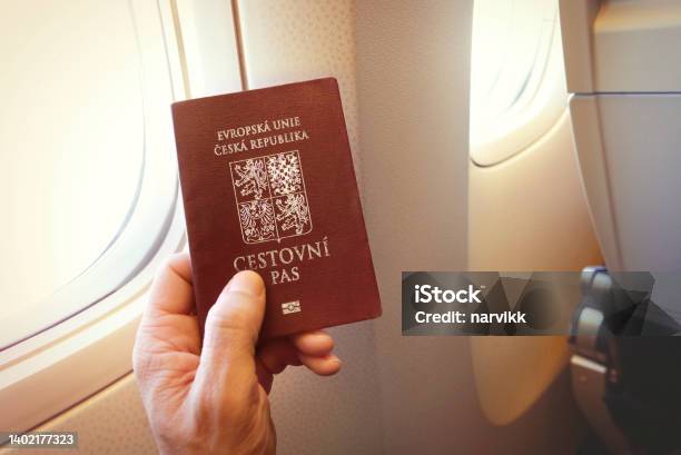 Passenger Holding Czech Passport On The Airplane Stock Photo - Download Image Now - Czech Republic, Passport, Airport