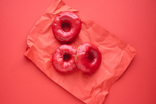 Donuts with Pink Icing Served with Coffee