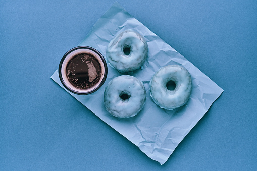 Donuts with Blue Icing Served with Coffee