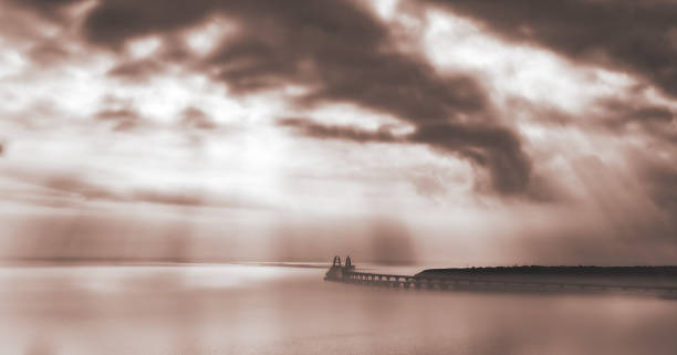 Crimean bridge in the morning cloudy haze. Dramatic panoramic seascape.