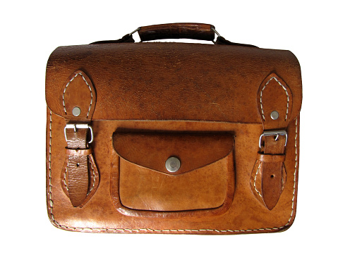 Old fashioned vintage brown leather suitcase on white
