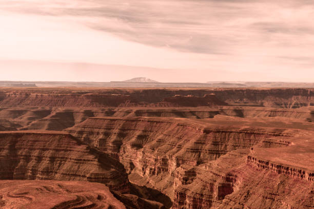 Wide, open skies, above rock formations in the desert of Monument Valley, USA.