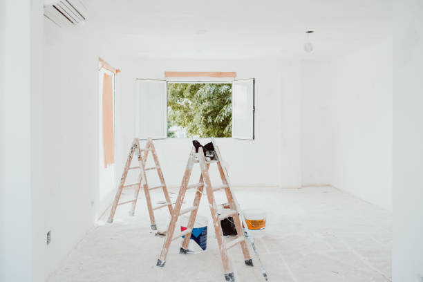 istock ladders and painter tools on white room at construction site. Painting walls. Home improvement, renovation 1402187146
