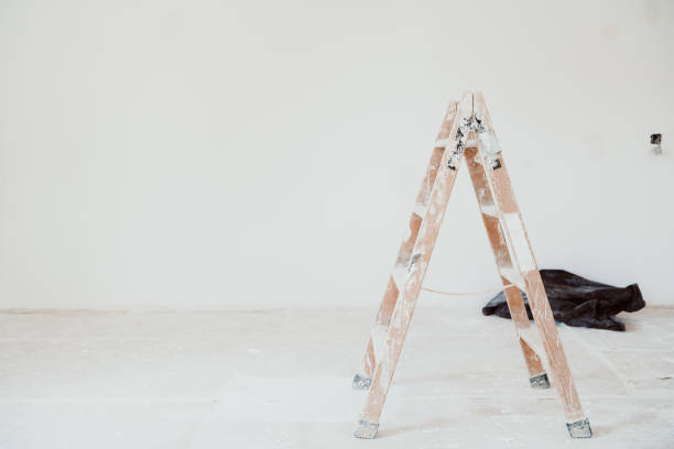 istock ladders and painter tools on white room at construction site. Painting walls. Home improvement 1402187167
