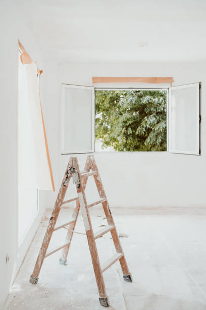 istock ladders and painter tools on white room at construction site. Painting walls. Home improvement 1402187183