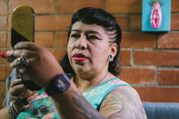 istock woman putting on makeup 1402191132