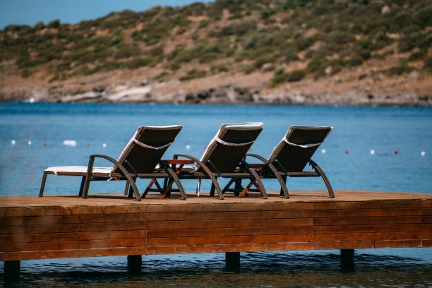 Sun Beds on the Pier in a Quiet Bay