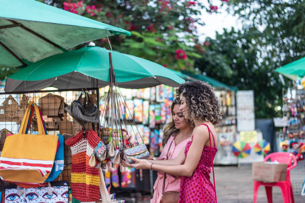 Mother and daughter looking at craft store Mother and daughter looking at craft store, Olinda, Pernambuco traditional festival stock pictures, royalty-free photos & images