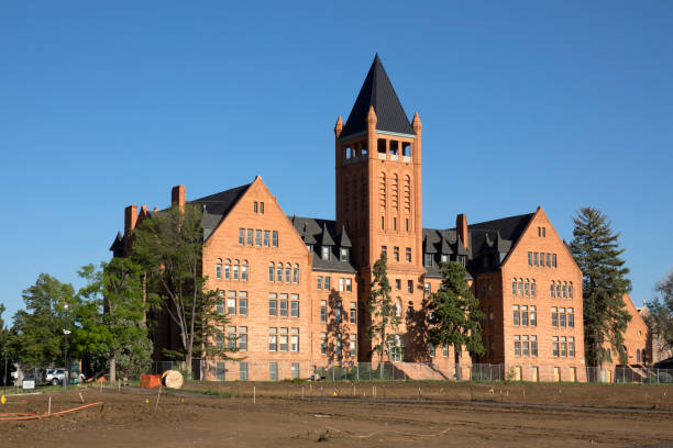 Built in 1891, the Romanesque red sandstone Loretto Heights Academy building with steep roofs and tower still stands in Denver County. The old Catholic boarding school for girls has gone under construction that will repurpose the entire campus for apartments and housing.
