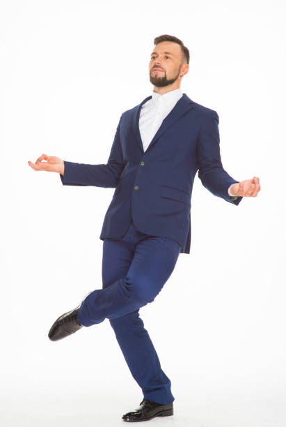 istock cheerful guy posing in a blue jacket on a white background isolated in the studio 1402193562