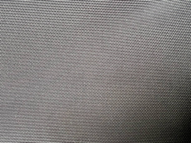 A very fine and black plastic fabric as a texture or background. stock photo