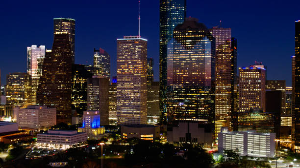 istock Downtown Skyscrapers in Houston, Texas at Night - Aerial 1402197006