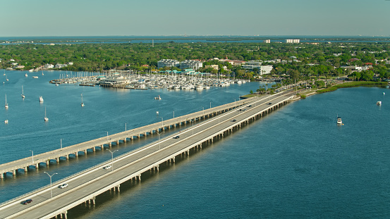 Aerial shot of the bridge leading into Palmetto, a small city in Manatee County, Florida on a sunny day.
