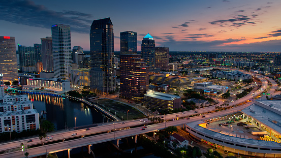 Aerial shot of Tampa, Florida during pre dawn hours. Drone grabs views of downtown from where the Sedon and Garrison Channels meet the Hillsborough River.