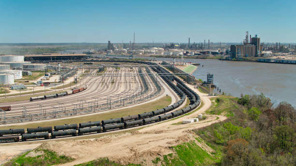 Aerial Shot of Train and Industrial Facilities Aerial shot of Beaumont, Texas on a clear sunny afternoon beaumont tx stock pictures, royalty-free photos & images