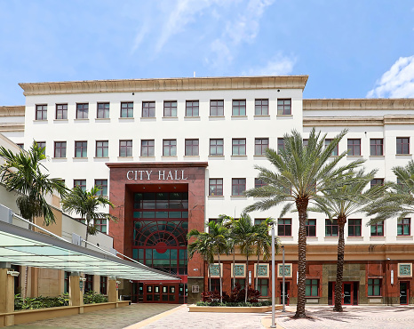 West Palm Beach, Florida, USA - April 27, 2022:  West Palm Beach City Administration (City Hall) Building , located next to the Mandel Public Library on Clemetis Street.